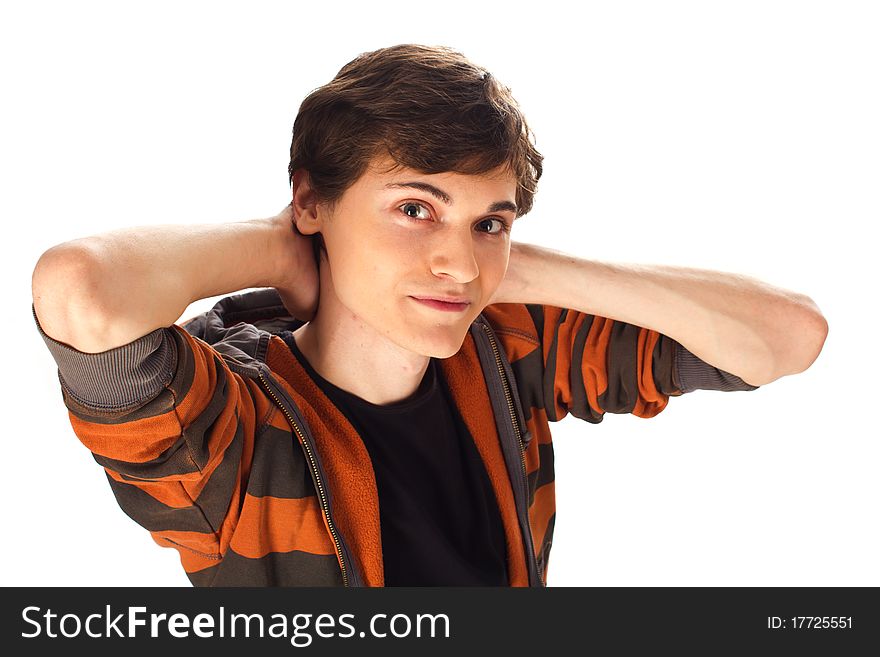 Handsome young man with hands behind the head standing on white background