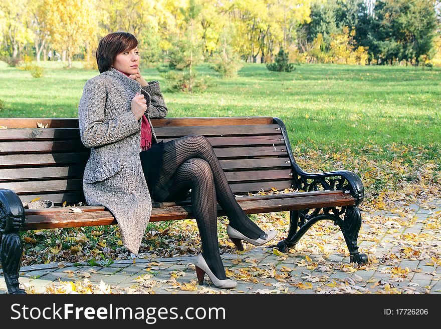 Girl in the park on a bench