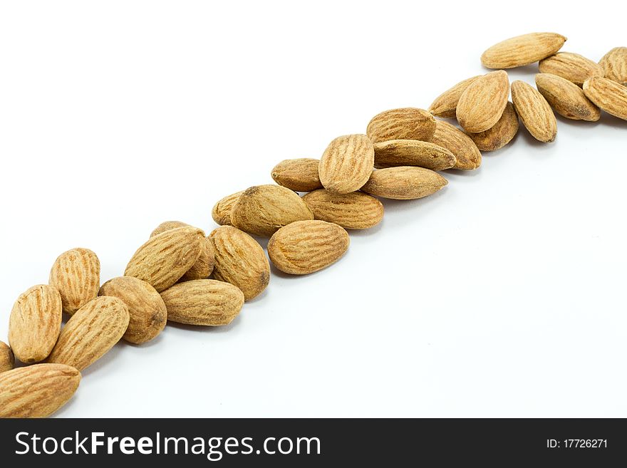 Pile of almonds isolated on white
