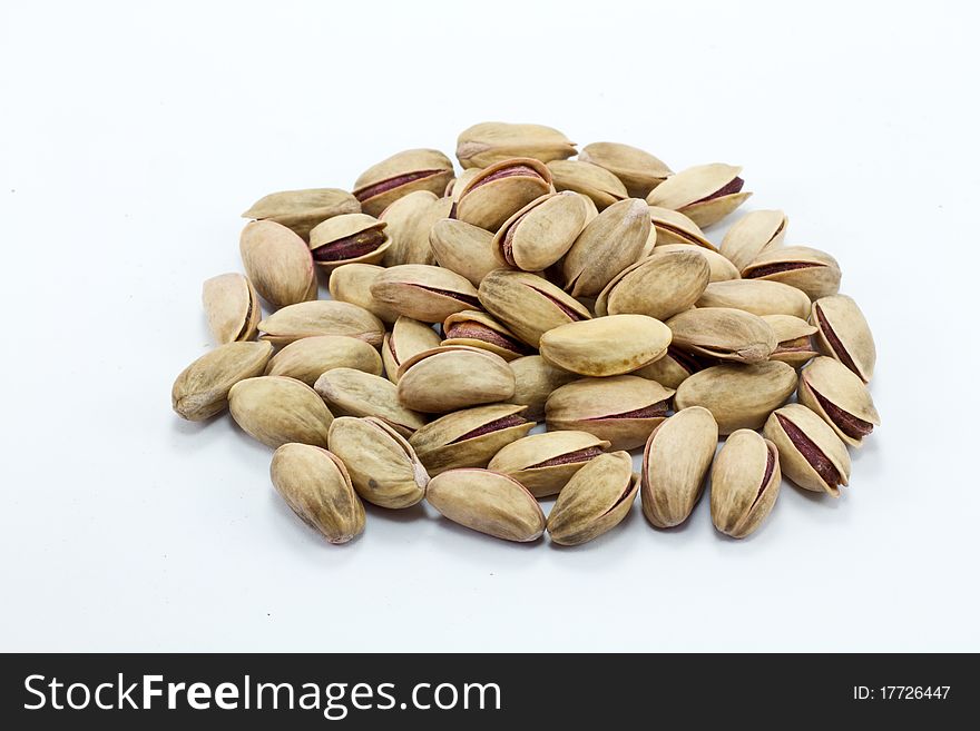 Pistachioile of Pistachio isolated on white