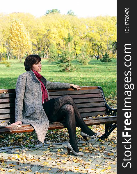 The girl in the park on a bench in nature