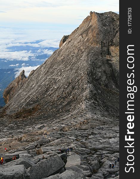 Climbers make their way down Mount Kinabalu Peak, Borneo, Malaysia. Climbers make their way down Mount Kinabalu Peak, Borneo, Malaysia