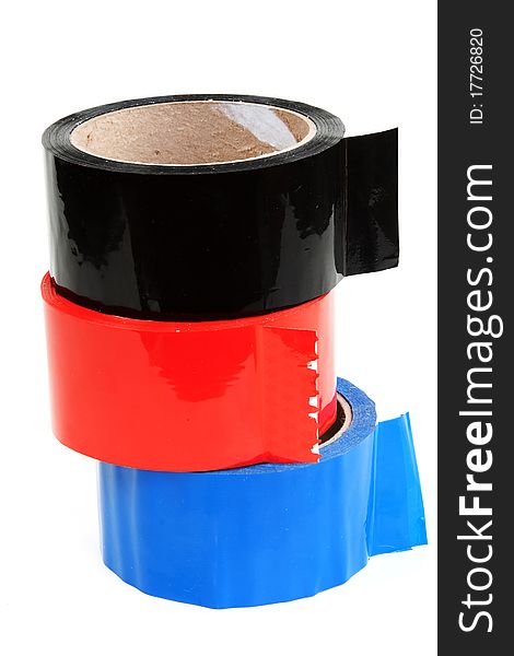 Three rolls of color tape blue, red and black