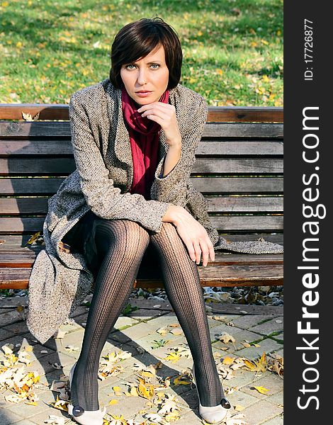 The girl in the park on a bench in nature