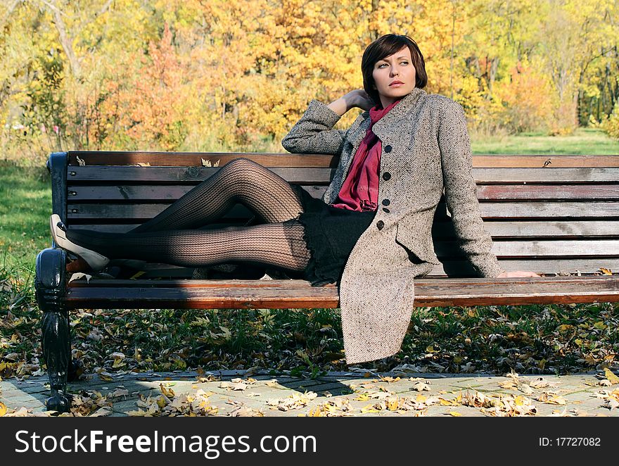 Girl in the park on a bench