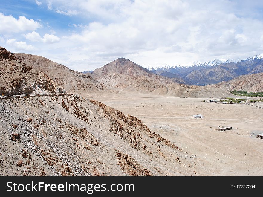 A dry and barren mountain landscape in a distant Himalayan region. A dry and barren mountain landscape in a distant Himalayan region.