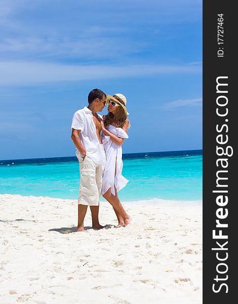 Happy Young Couple On A Beach