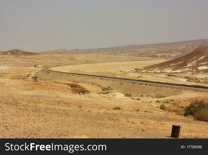 View of a desert mountains and railroad in the Negev desert, Israel. View of a desert mountains and railroad in the Negev desert, Israel
