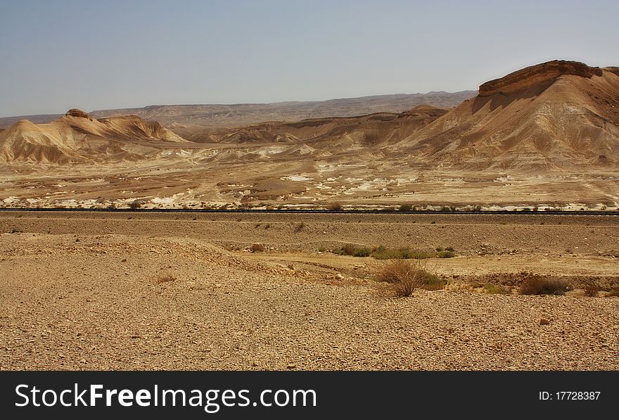 View of a desert mountains and railroad  in the Negev desert, Israel. View of a desert mountains and railroad  in the Negev desert, Israel