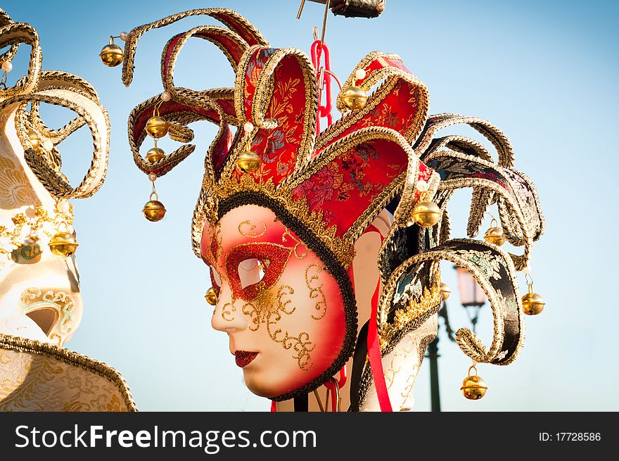 A brilliant red papier-mache mask for traditional carnival in Venice. A brilliant red papier-mache mask for traditional carnival in Venice