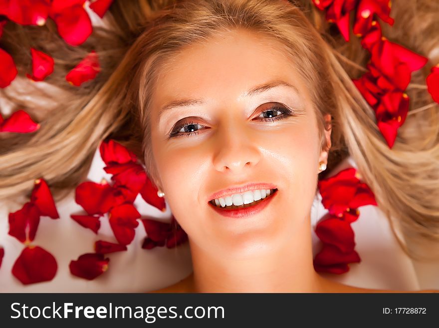 Woman Laying With Rose Petals