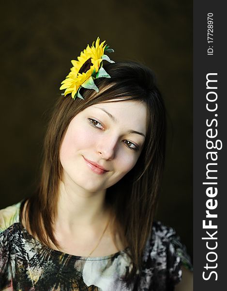 A beautiful woman with sunflower in her hair