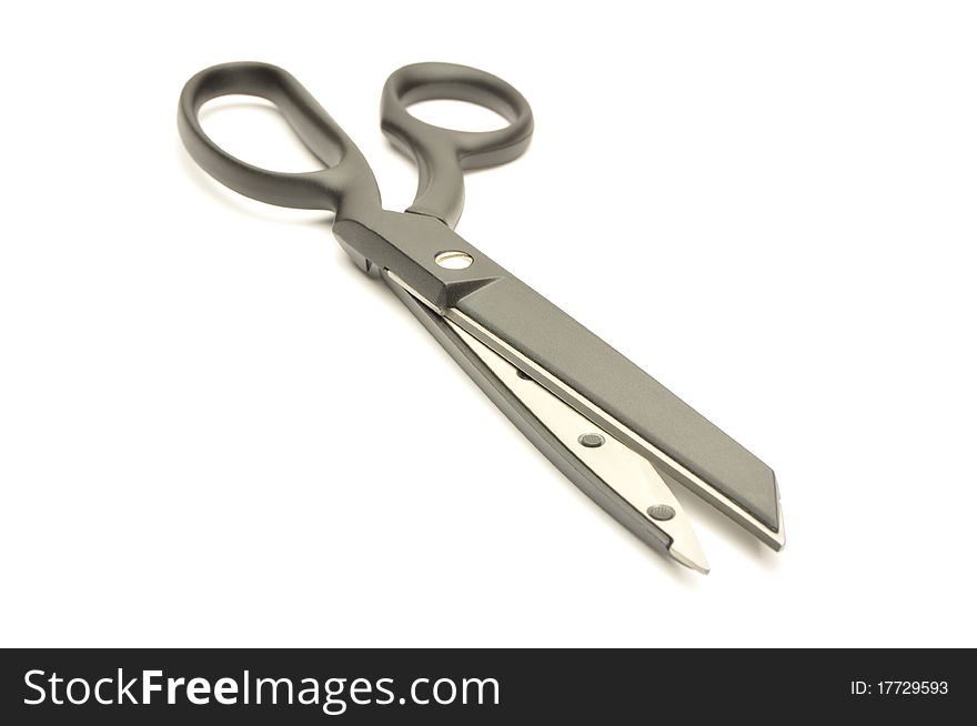 Sewing scissors on a white background