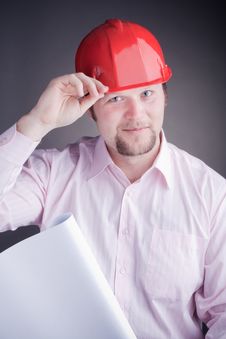 Young Engineer With Blueprints Raises His Hat Stock Images Young Engineer With Blueprints Raises His Hat Stock Images