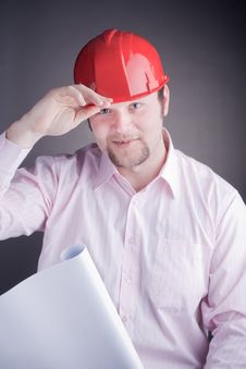Young Engineer With Blueprints Raises His Hat Stock Photography Young Engineer With Blueprints Raises His Hat Stock Photography