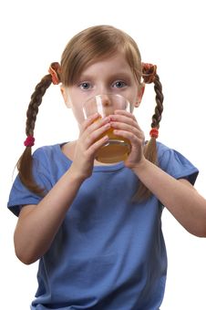 Young Funny Girl With A Glass Of Juice Royalty Free Stock Image