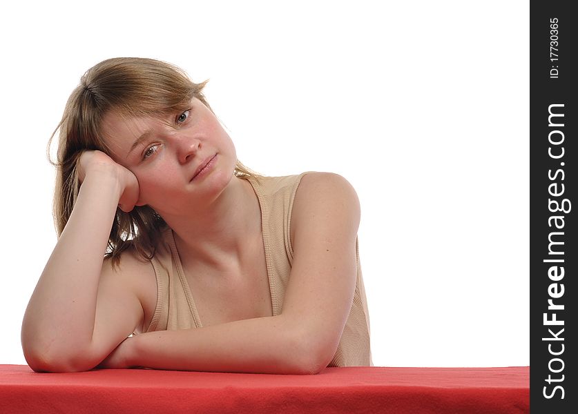 Young blond woman with rather serious pensive expression and his head tilted. Studio shot against white background. Young blond woman with rather serious pensive expression and his head tilted. Studio shot against white background