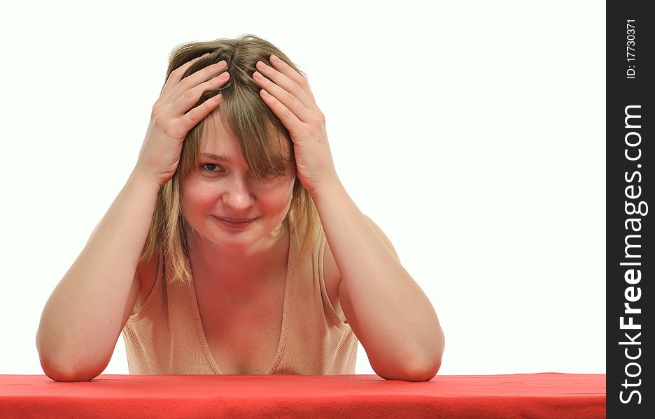 Young blond woman in commotion; studio shot against white. Young blond woman in commotion; studio shot against white