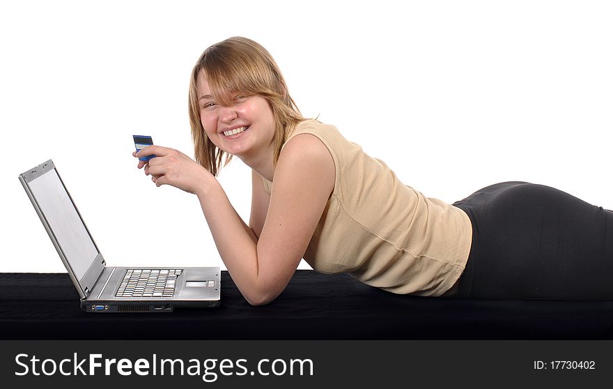 Young blond with laptop. Studio shot against white background. Young blond with laptop. Studio shot against white background