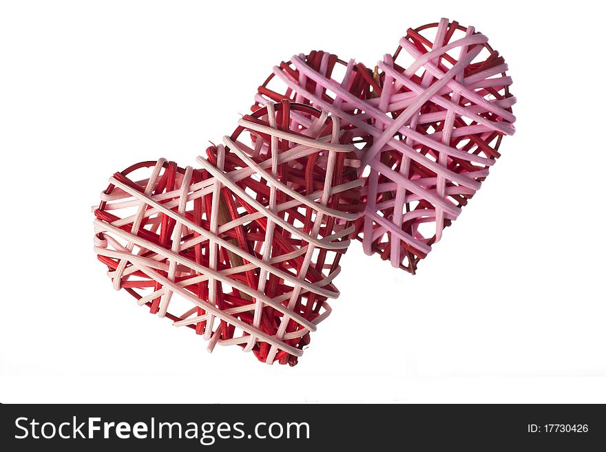 Red and pink wicker valentines hearts isolated on a white background. Red and pink wicker valentines hearts isolated on a white background.