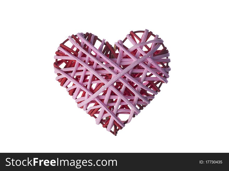 Red and pink wicker valentines heart isolated on a white background. Red and pink wicker valentines heart isolated on a white background.