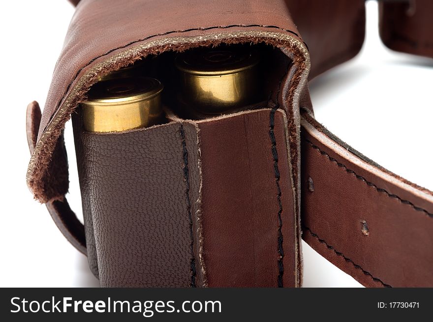 Brown leather bandolier of bullets on a white background. Brown leather bandolier of bullets on a white background.