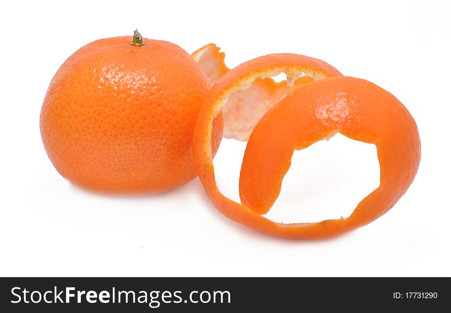 Picture of ripe mandarine with a skin on a white background