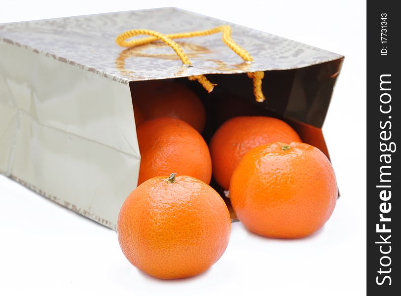 Picture of package with by ripe mandarines on a white background. Picture of package with by ripe mandarines on a white background