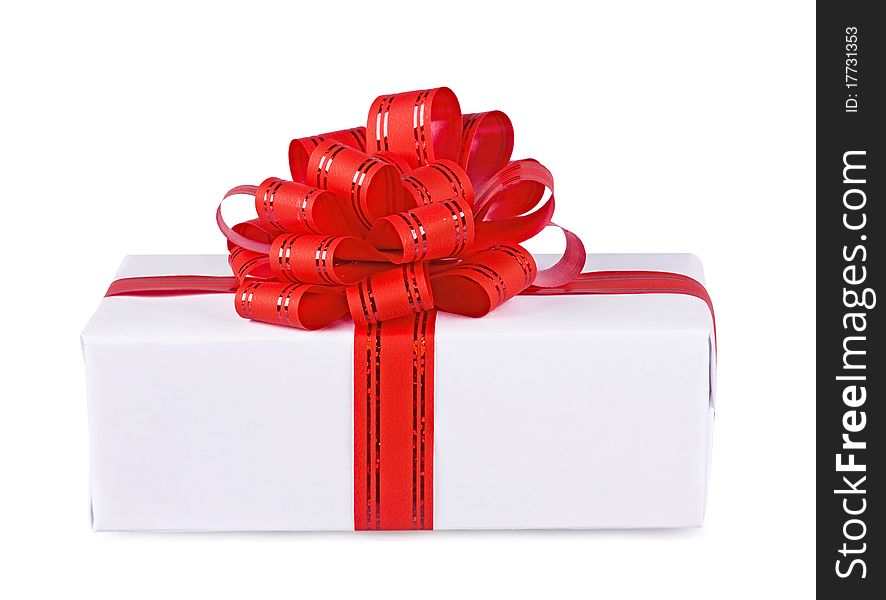 Gift decorated with a red bow on a white background