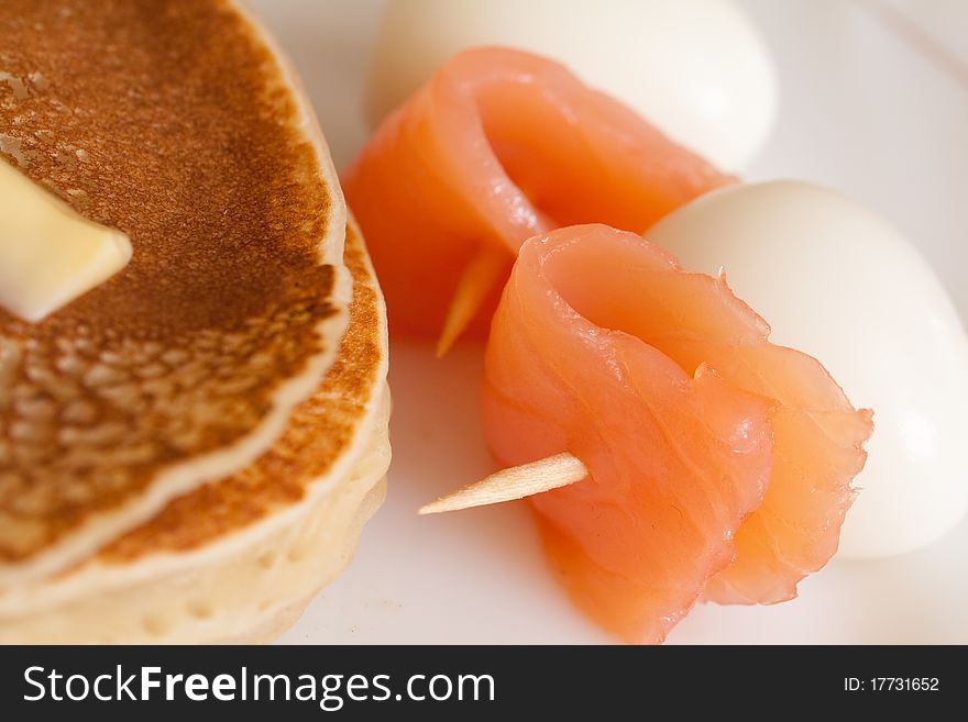 Pancake with salmon and egg canape. Pancake with salmon and egg canape