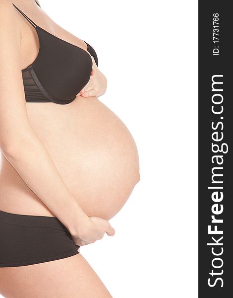 Pregnant tummy on an isolated white background. Pregnant tummy on an isolated white background