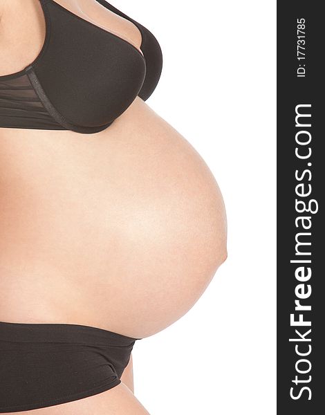 Pregnant tummy on an isolated white background. Pregnant tummy on an isolated white background