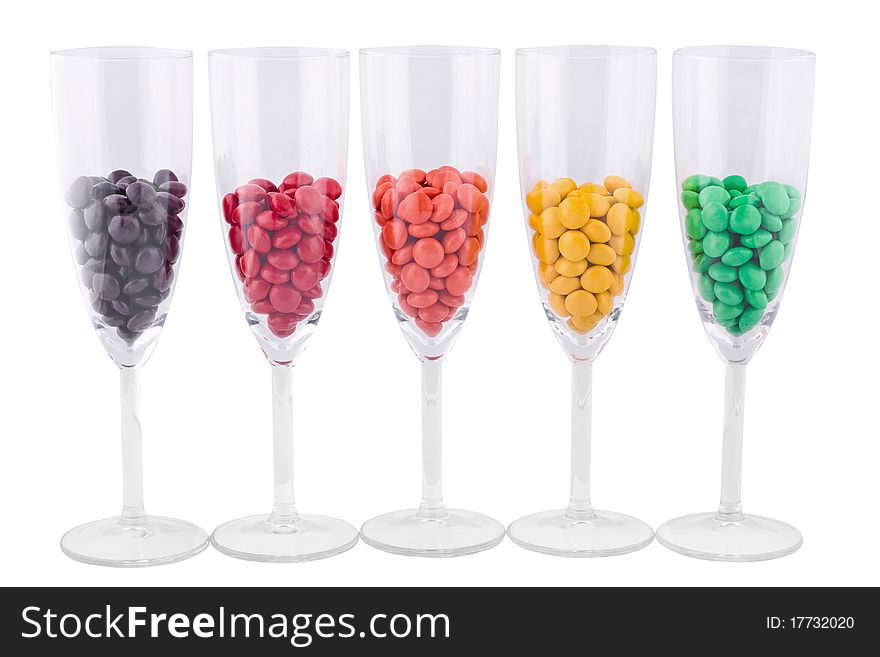 Five wine glasses with a color dragee