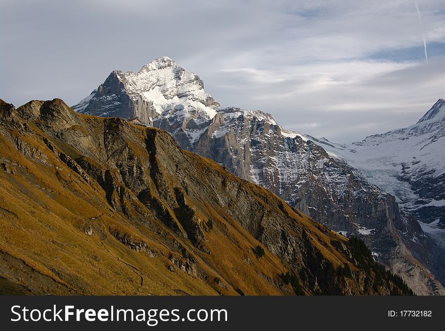 Mountain landscape with snowy Jungfrau peaks in Swiss Alps. Taken in November 2010. Mountain landscape with snowy Jungfrau peaks in Swiss Alps. Taken in November 2010.