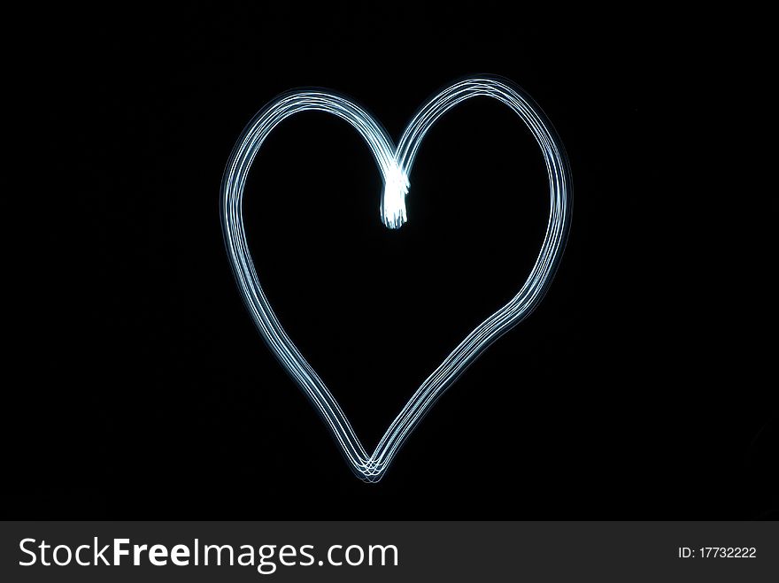 Blue heart against the black background. Blue heart against the black background