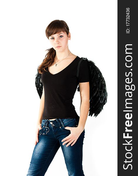 Beautiful girl standing in black wings