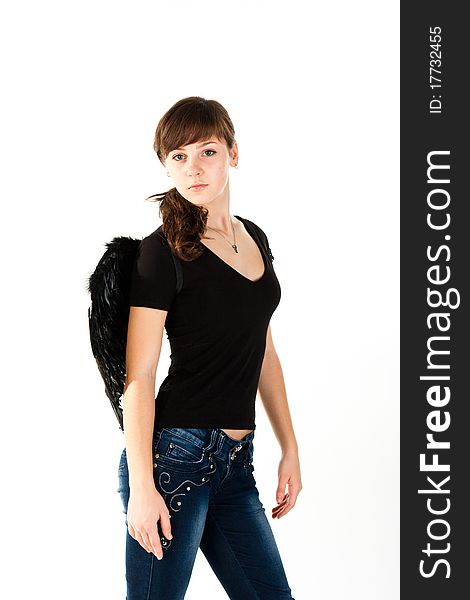 Beautiful girl standing in black wings