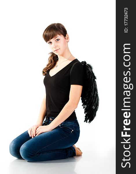 Beautiful girl sitting in black wings