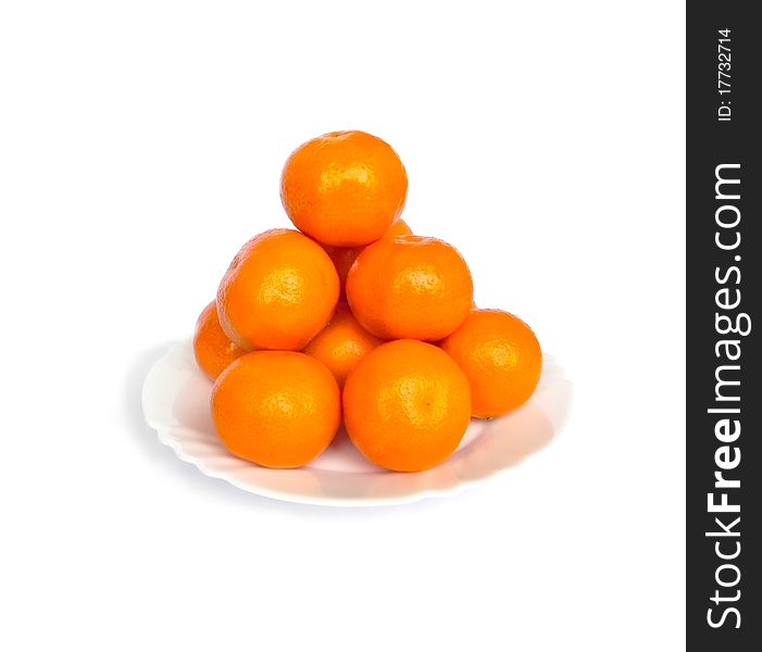 Tangerines on white background are shown in the picture. Tangerines on white background are shown in the picture.