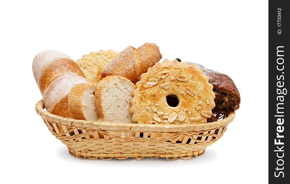 Basket of various fresh baked bread isolated on the white