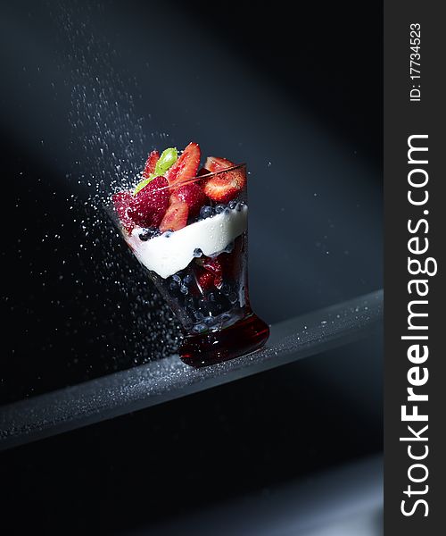 Delicious Strawberry desert in dark background