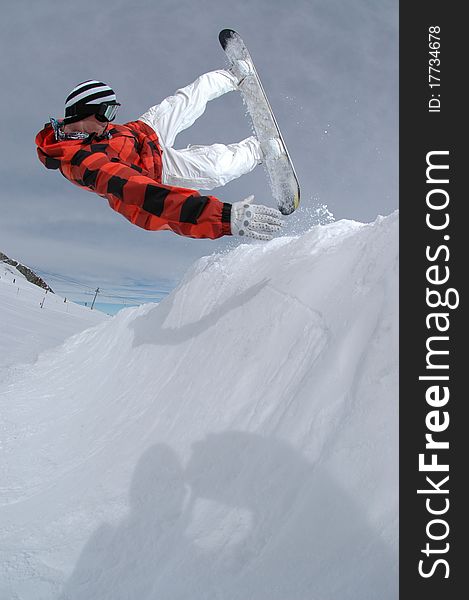 Jumping Freestyle Snowboarder