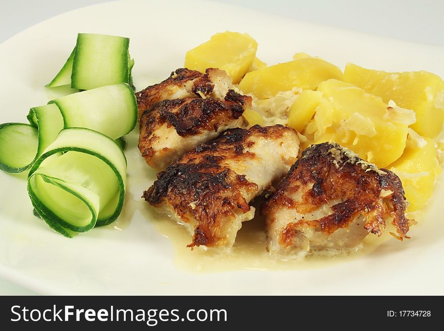 Dish - Grilled meat turkey with potatoes and cucumber