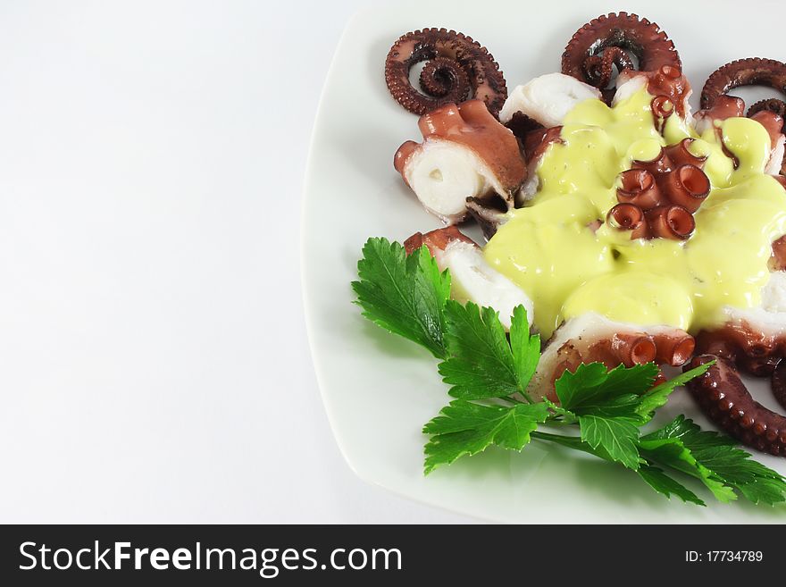 Octopus salad with olive mayonnaise, closeup