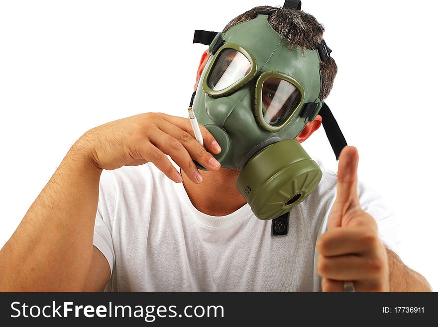 Man wearing gas mask showing ok sign, smoking. Man wearing gas mask showing ok sign, smoking