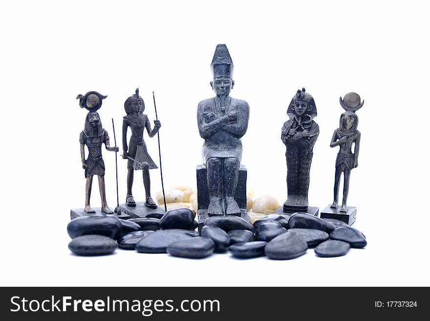 Egyptian ceramic figures onto white background