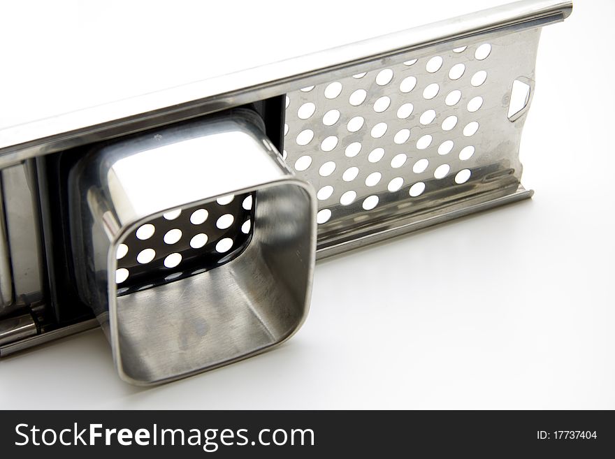 Potato grater of metal with article