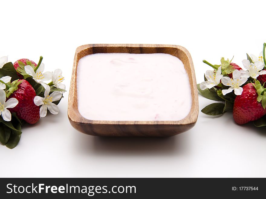 Strawberry yogurt in the wood bowl