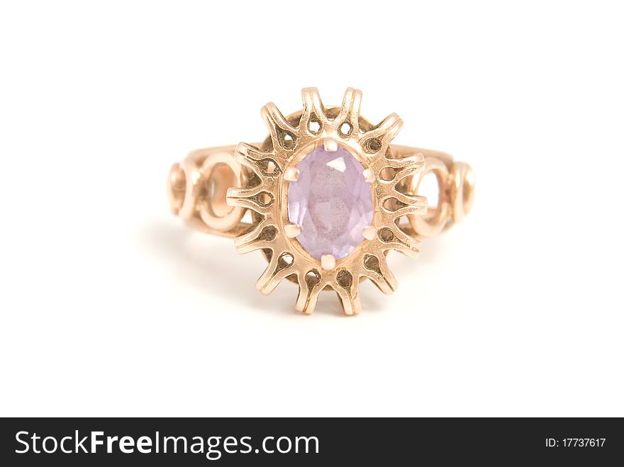 The Golden Ring with amethyst, is isolated on a white background