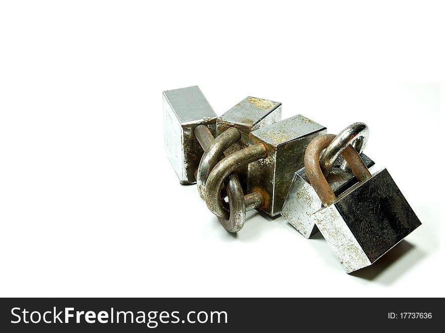 A group of rusted padlocks, isolated white background. Can be use to symbolize security, safety. A group of rusted padlocks, isolated white background. Can be use to symbolize security, safety.